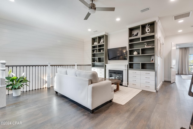 living room featuring dark hardwood / wood-style flooring and ceiling fan