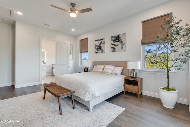 bedroom with connected bathroom, ceiling fan, and hardwood / wood-style floors