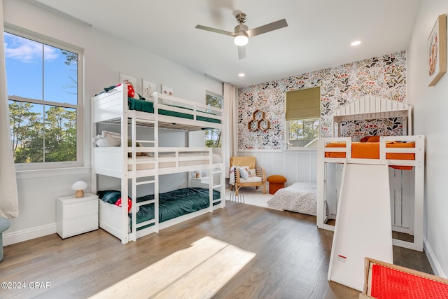 bedroom with ceiling fan and hardwood / wood-style floors