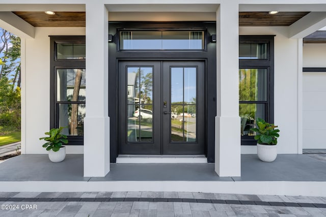 entrance to property with french doors and a garage