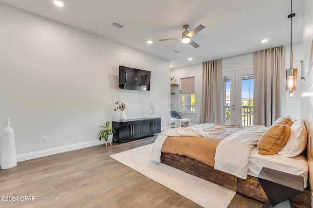 bedroom featuring ceiling fan, hardwood / wood-style flooring, and access to outside