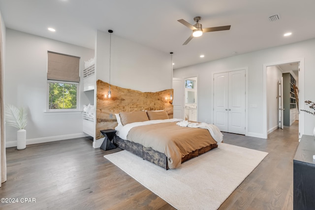 bedroom featuring a closet, dark hardwood / wood-style flooring, and ceiling fan