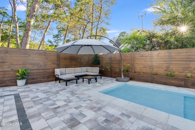 view of swimming pool featuring a patio area and outdoor lounge area