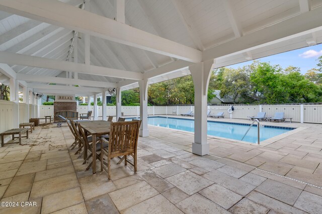 view of swimming pool with a patio area