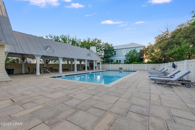 view of pool with a patio and a gazebo