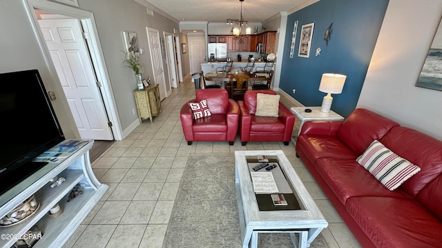 living room with crown molding, light tile flooring, and a chandelier