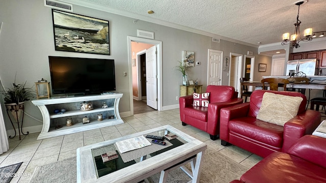 tiled living room featuring a textured ceiling, a notable chandelier, and ornamental molding