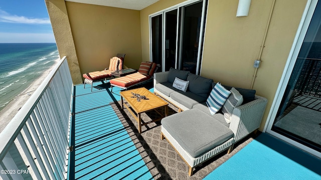 balcony featuring a water view and outdoor lounge area