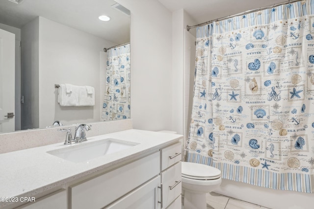 full bathroom with shower / bath combo, toilet, tile floors, and vanity with extensive cabinet space