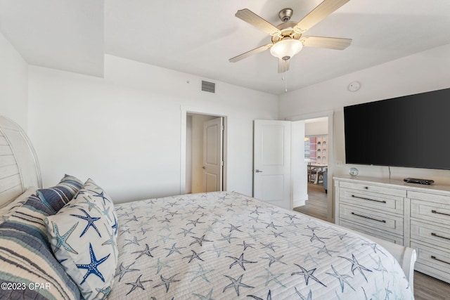 bedroom featuring ceiling fan and light hardwood / wood-style flooring