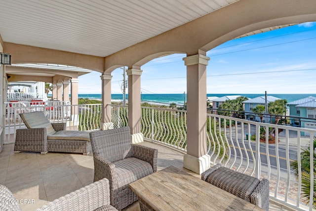 balcony featuring a water view