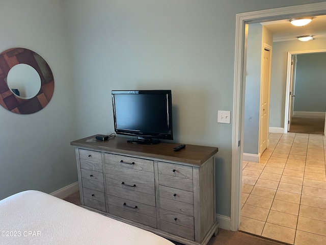 bedroom featuring light tile patterned floors