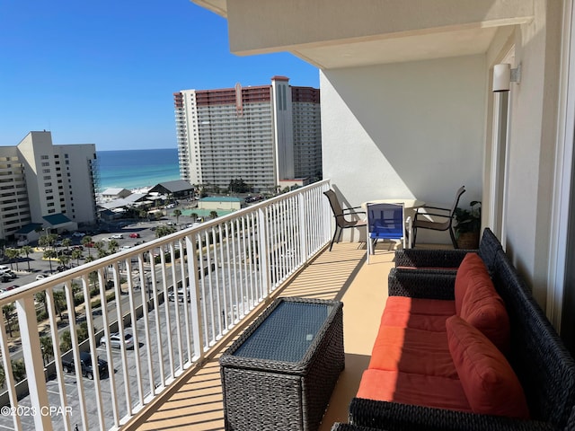 balcony featuring a water view