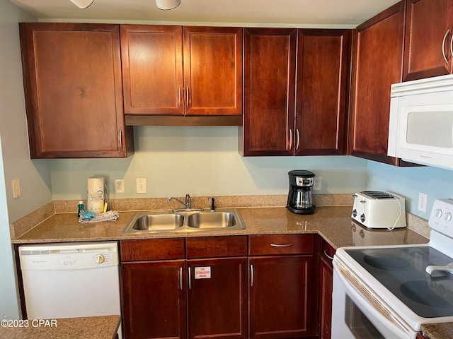 kitchen with sink and white appliances