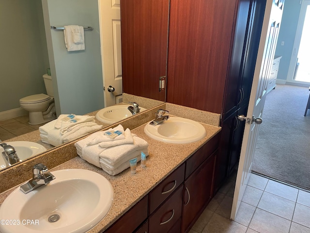 bathroom featuring vanity, toilet, and tile patterned floors