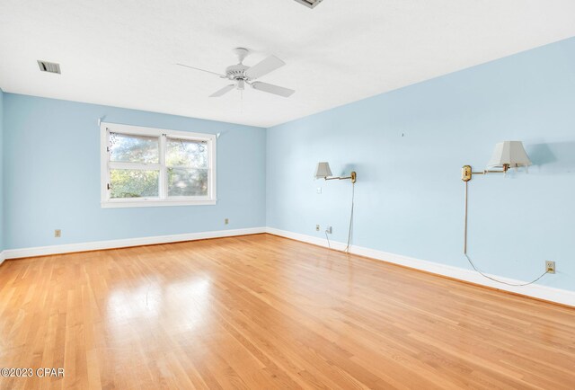 unfurnished room featuring ceiling fan and light wood-type flooring