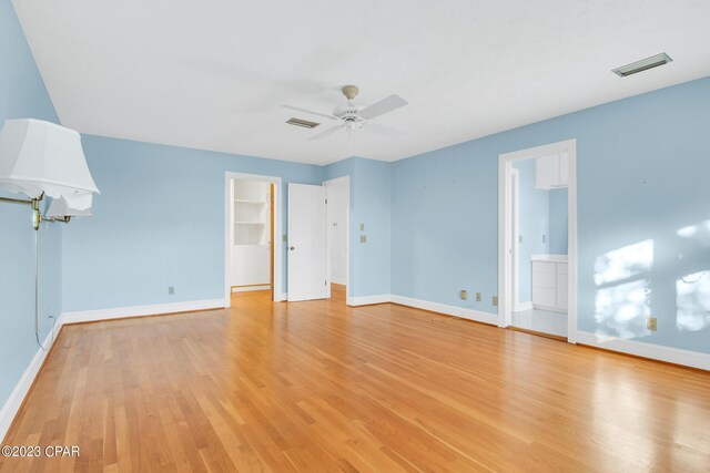 unfurnished room with ceiling fan and light hardwood / wood-style flooring