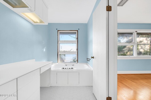 bathroom featuring a tub