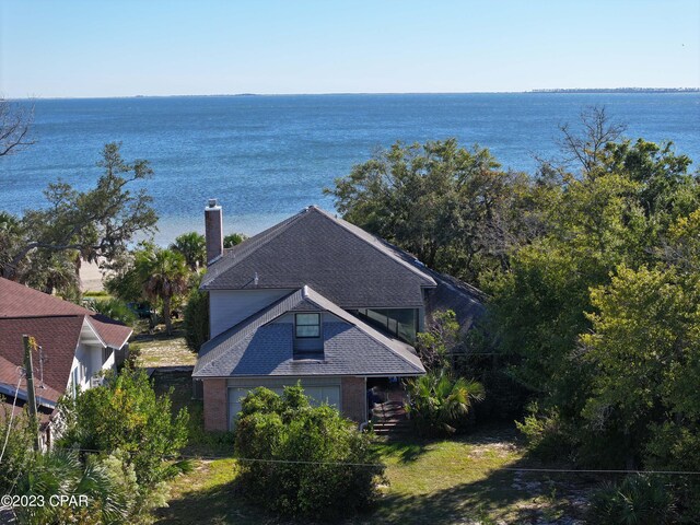 birds eye view of property with a water view