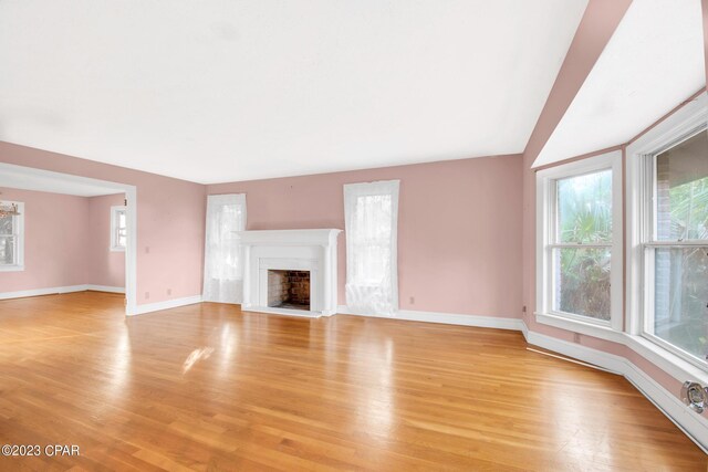 unfurnished living room featuring light wood-type flooring