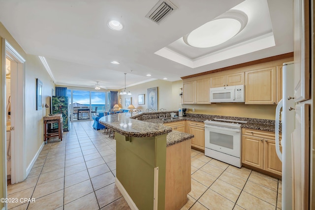 kitchen featuring white appliances, kitchen peninsula, light brown cabinets, light tile patterned floors, and ceiling fan