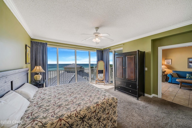 carpeted bedroom featuring a water view, access to exterior, a textured ceiling, crown molding, and ceiling fan