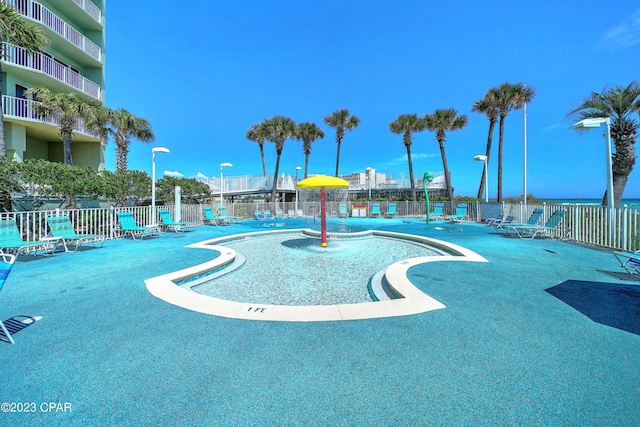 view of pool featuring pool water feature