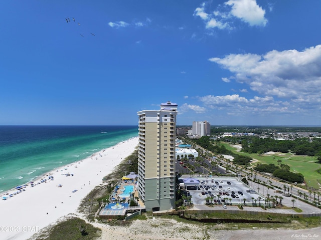 drone / aerial view featuring a water view and a beach view