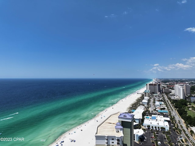 birds eye view of property with a beach view and a water view