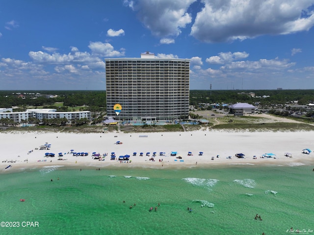 birds eye view of property with a beach view and a water view