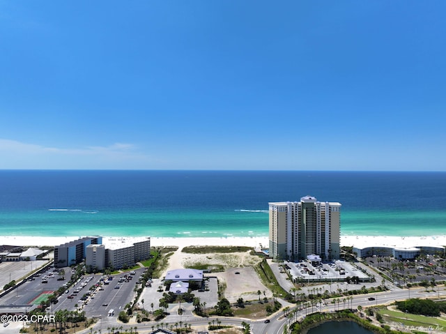 aerial view with a water view and a view of the beach