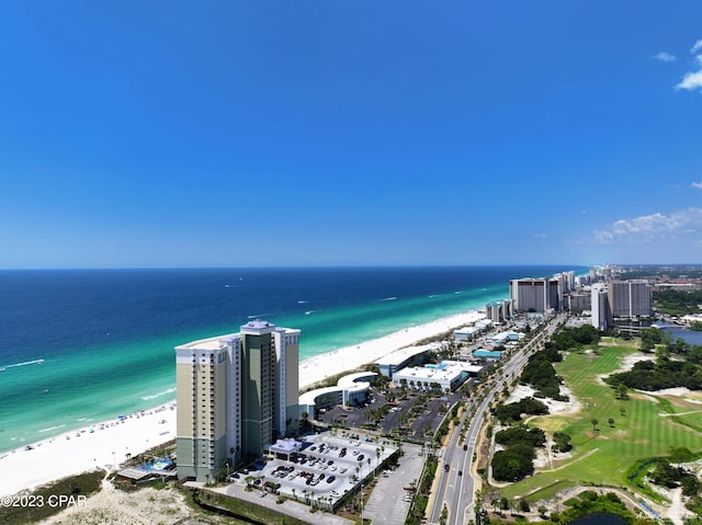 bird's eye view featuring a view of the beach and a water view