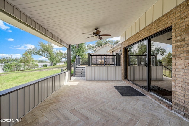 view of patio featuring ceiling fan