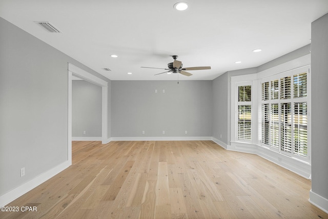 spare room with ceiling fan and light hardwood / wood-style floors