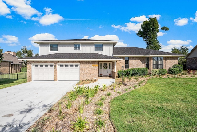 view of front of house featuring a garage and a front yard