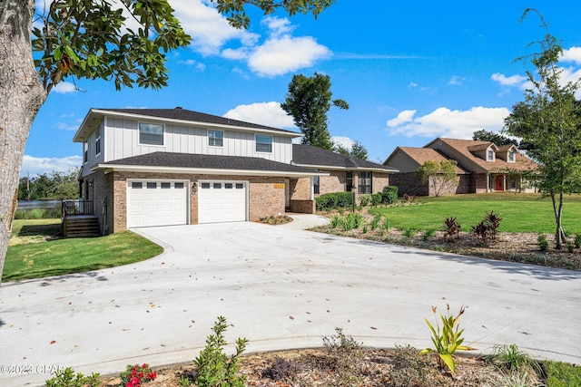 view of property featuring a garage and a front yard