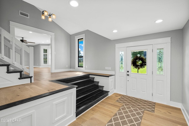 entryway featuring ceiling fan, light hardwood / wood-style flooring, and lofted ceiling