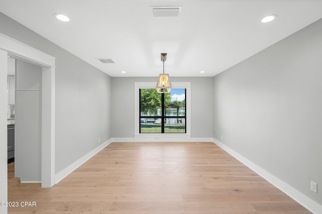 unfurnished dining area featuring light hardwood / wood-style floors