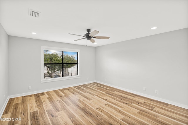 spare room with ceiling fan and light hardwood / wood-style flooring