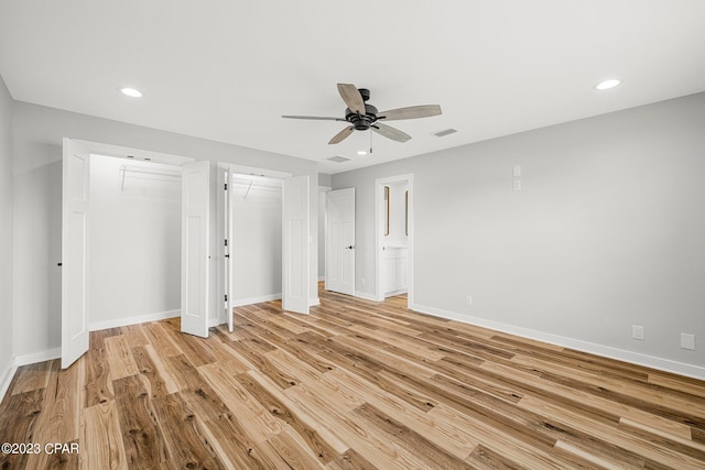 unfurnished bedroom featuring light hardwood / wood-style flooring and ceiling fan