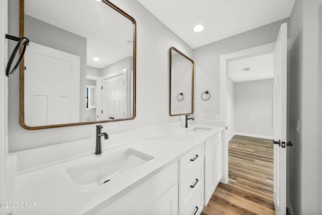 bathroom featuring hardwood / wood-style floors and vanity