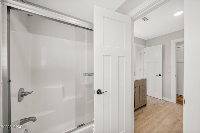 bathroom with hardwood / wood-style floors and vanity