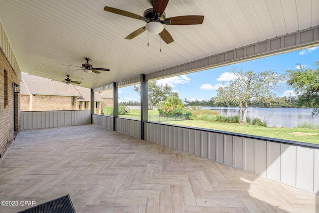 view of patio with a water view