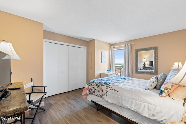 bedroom featuring a closet and wood finished floors