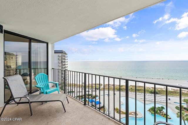 balcony featuring a water view