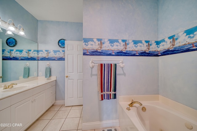 bathroom with tile patterned flooring, vanity, and a bath