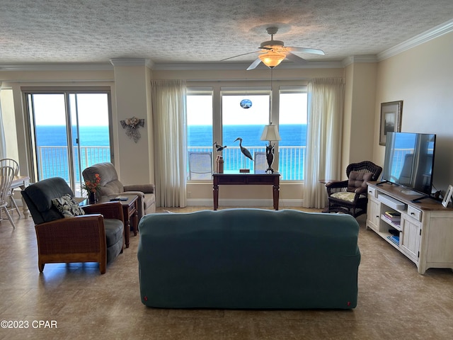 living room featuring crown molding, a water view, a textured ceiling, and ceiling fan