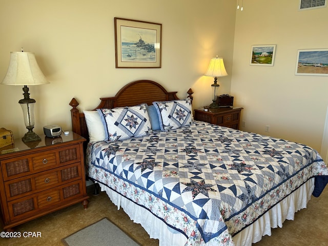 bedroom featuring dark colored carpet