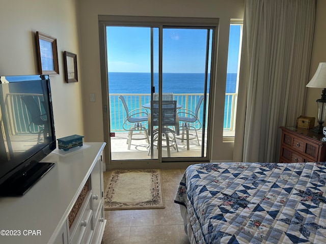 tiled bedroom featuring a water view