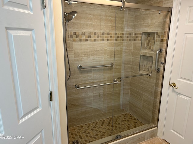 bathroom with an enclosed shower